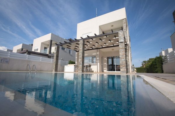 The photo is showcasing Anemoni Villa in Protaras, the pool and the exterior area of the villa.